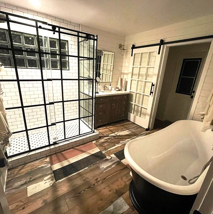 Tub and a Black Shower Enclosure