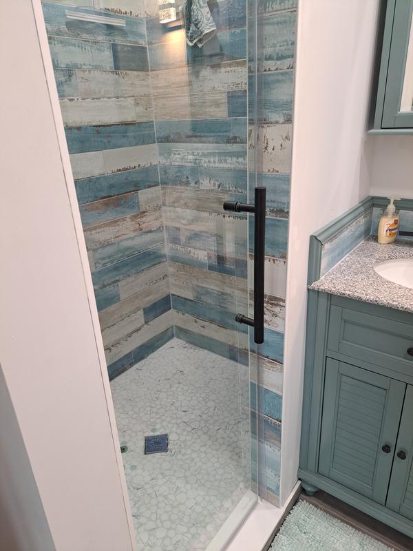Bathroom with a Shower Door From Aston Bath